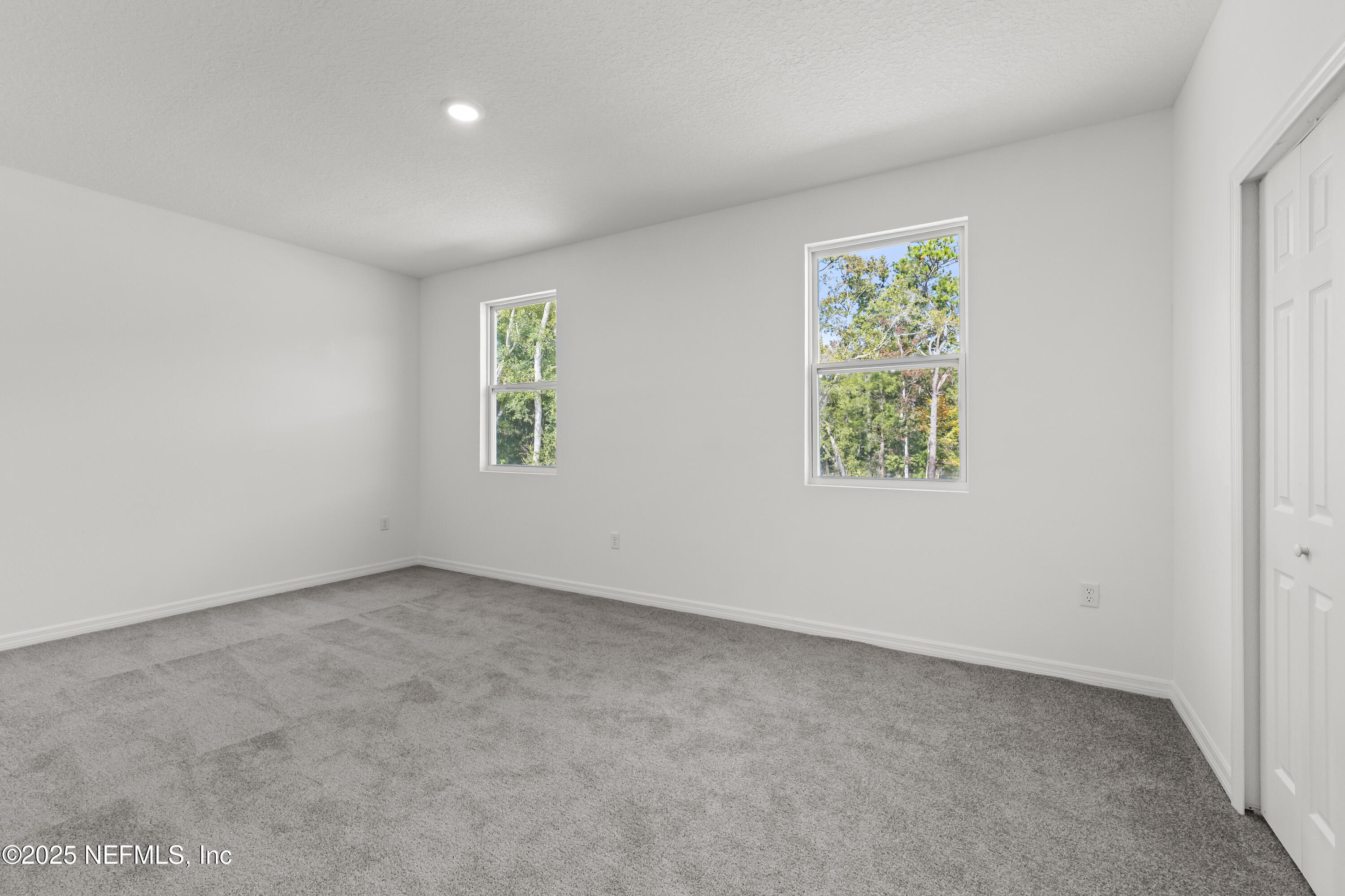 12476 Gate Road Jacksonville, FL 32226 - Photo 19 of 29 an empty room with windows