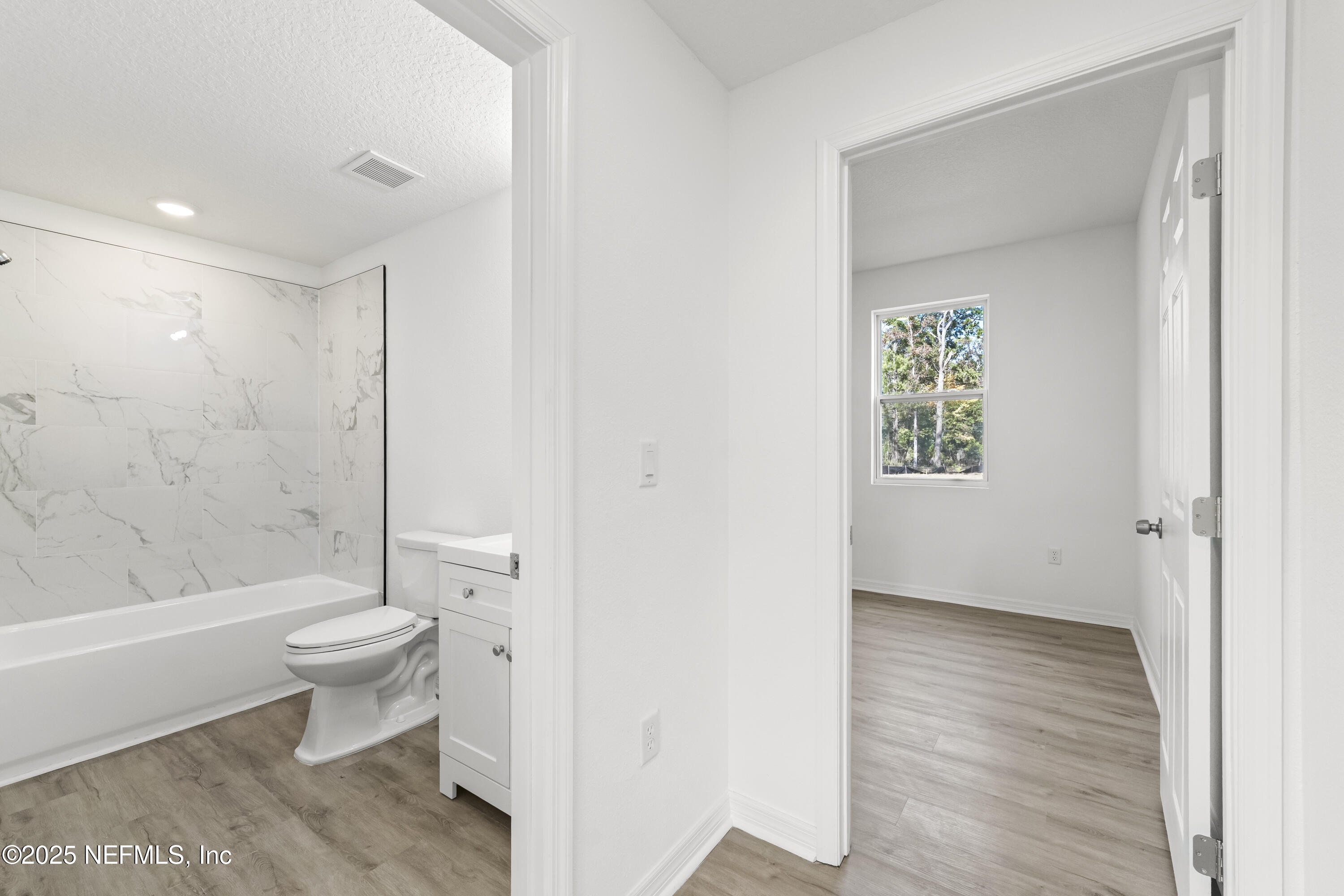 12476 Gate Road Jacksonville, FL 32226 - Photo 22 of 29 a bathroom with a toilet and a shower