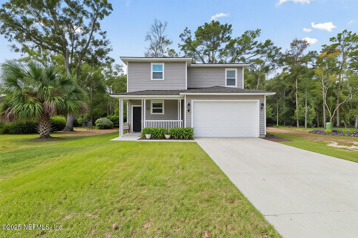 12476 Gate Road Jacksonville, FL 32226 - Photo 25 of 29 a front view of house with yard and green space