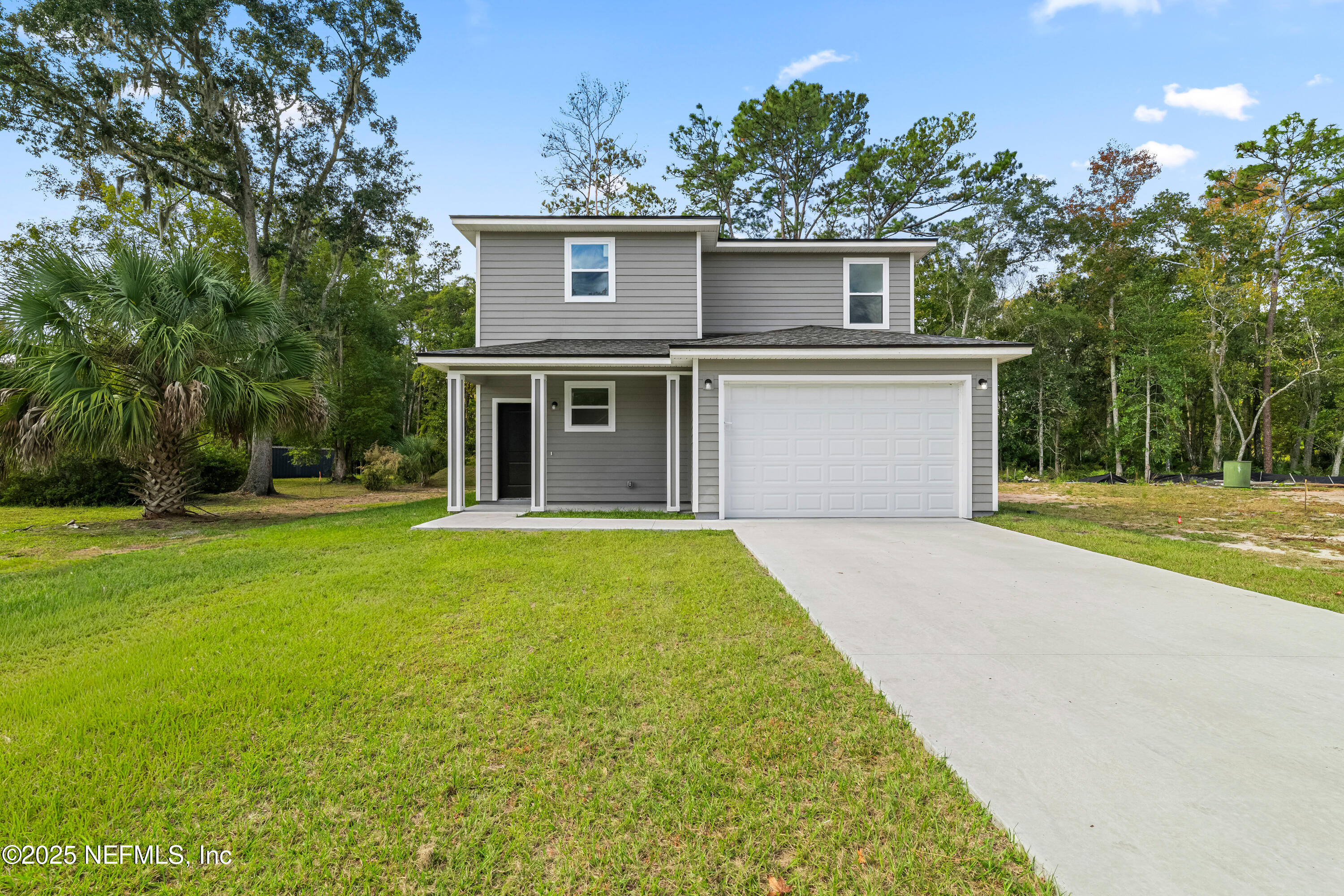 12476 Gate Road Jacksonville, FL 32226 - Photo 26 of 29 a front view of house with yard and trees