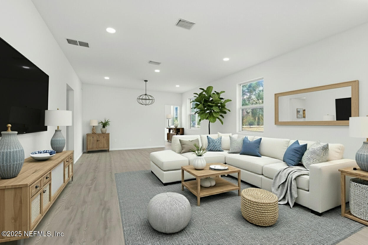 12476 Gate Road Jacksonville, FL 32226 - Photo 4 of 29 a living room with furniture and a flat screen tv