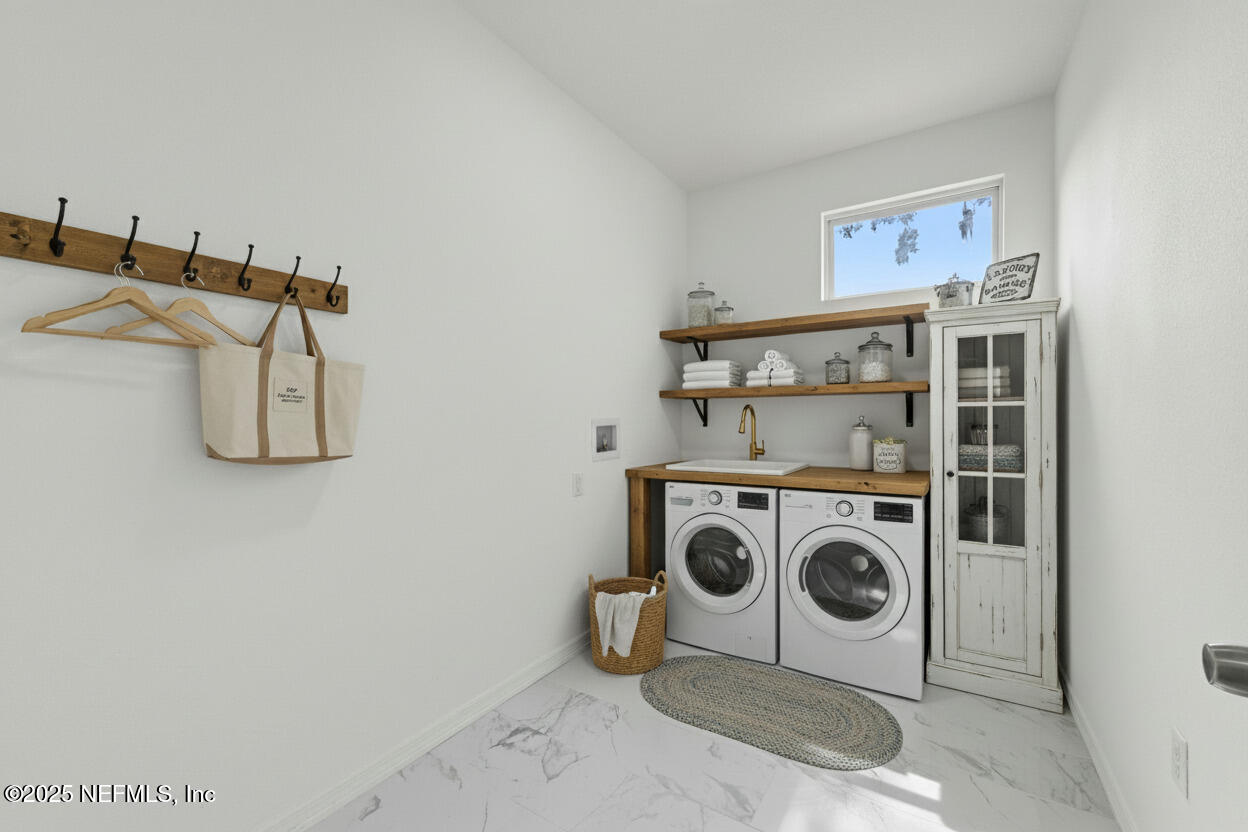 12476 Gate Road Jacksonville, FL 32226 - Photo 6 of 29 a utility room with dryer and washer