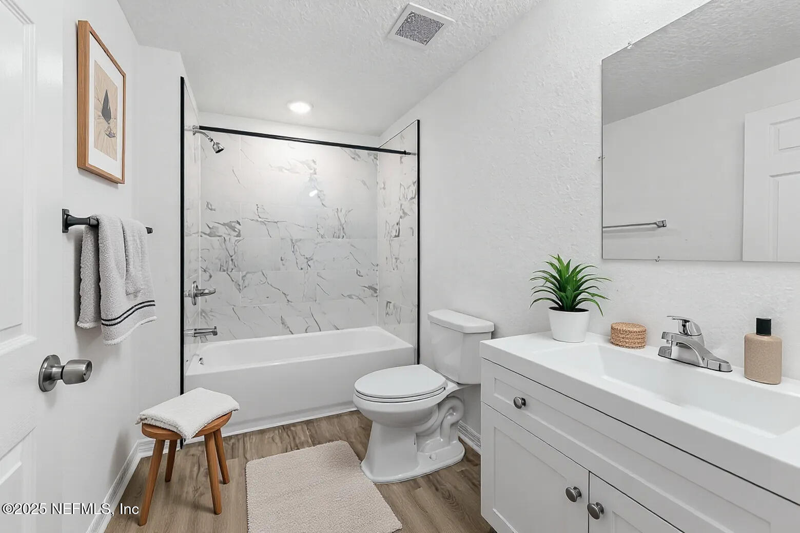 12476 Gate Road Jacksonville, FL 32226 - Photo 7 of 29 a bathroom with a toilet a sink and a shower