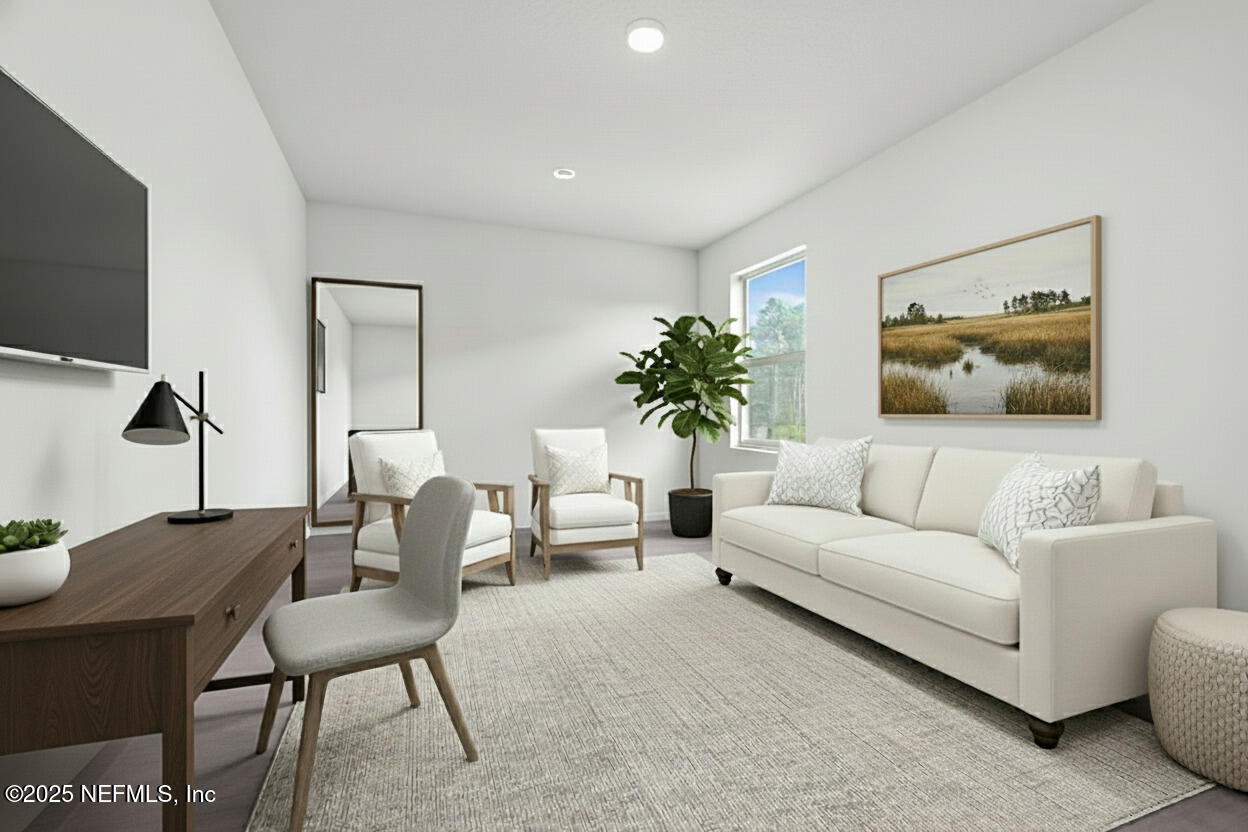 12476 Gate Road Jacksonville, FL 32226 - Photo 10 of 29 a living room with furniture and a flat screen tv