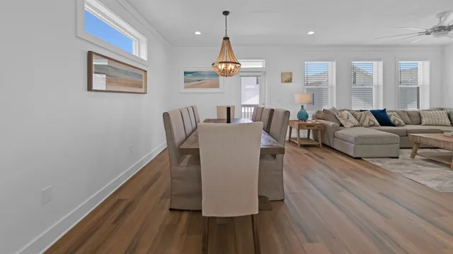 a large kitchen with a table and chairs