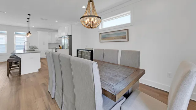 a kitchen with granite countertop a stove a sink and dishwasher