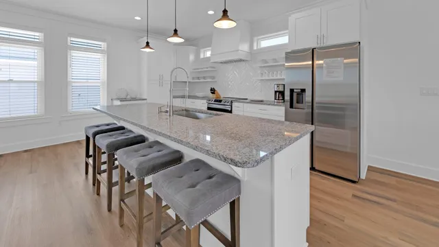 a bed room with a bed and a chair