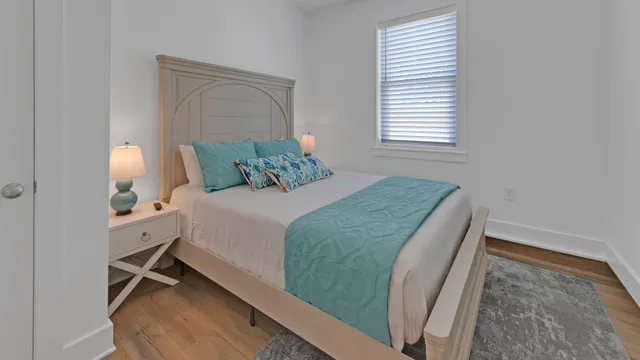 a bedroom with a bed and a dresser