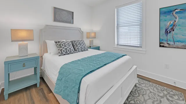 a bathroom with a granite countertop toilet sink and mirror