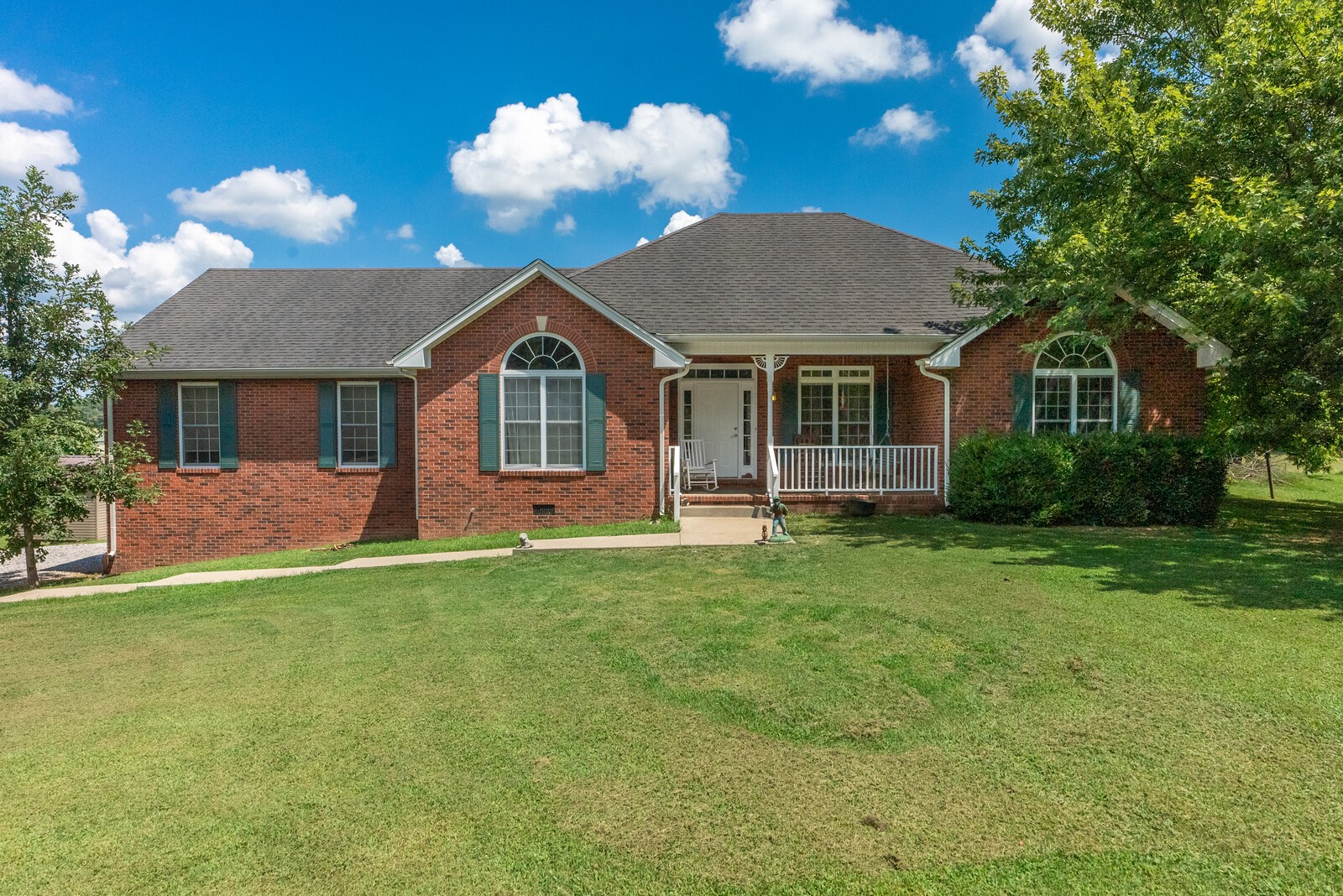 6159 H B Lee Road Springfield, TN 37172 - Photo 1 of 28 a front view of a house with a garden