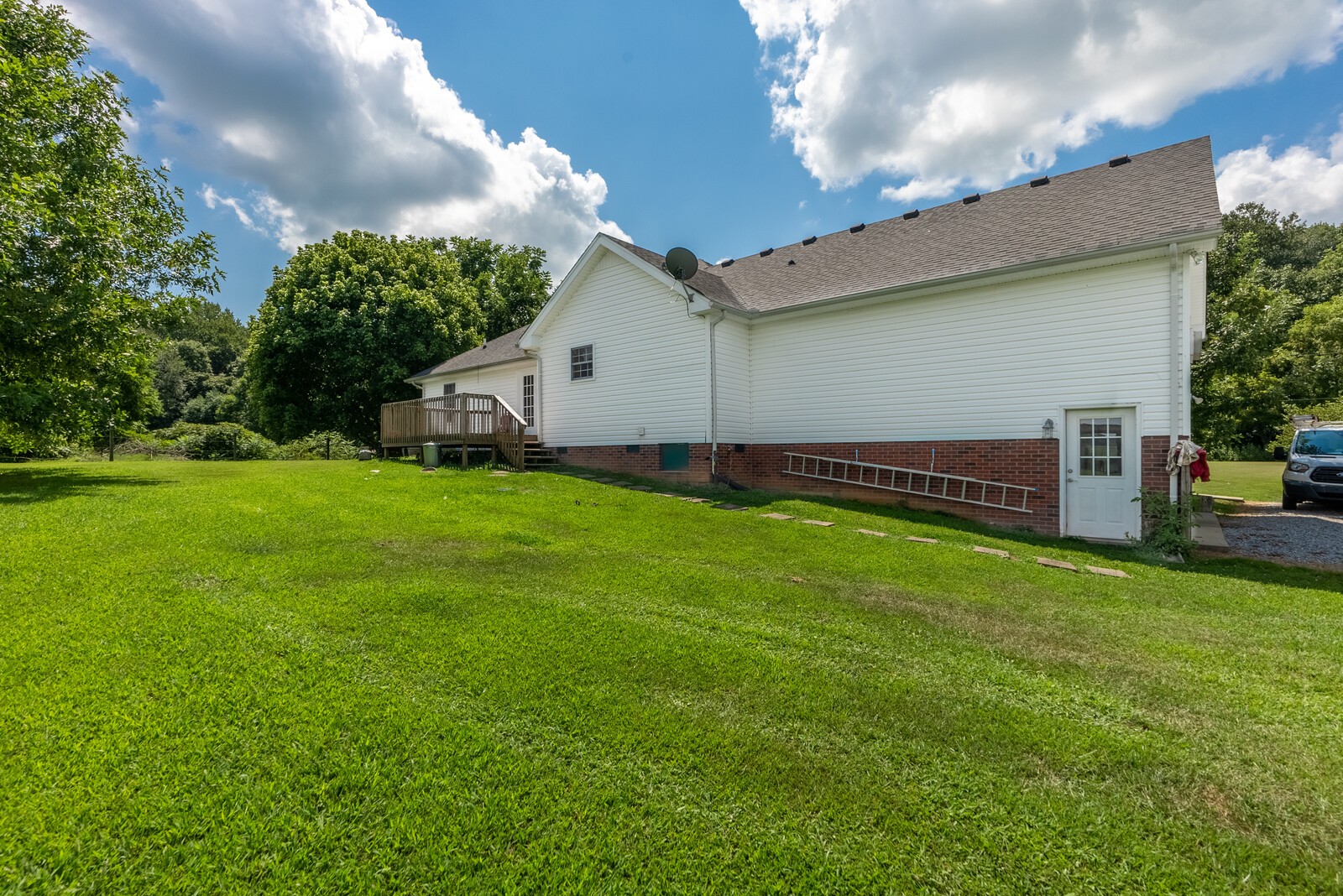 6159 H B Lee Road Springfield, TN 37172 - Photo 22 of 28 a view of a backyard with plants and a garden