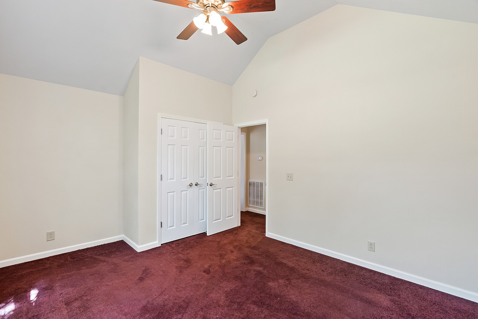 6159 H B Lee Road Springfield, TN 37172 - Photo 9 of 28 an empty room with a chandelier fan and wooden floor