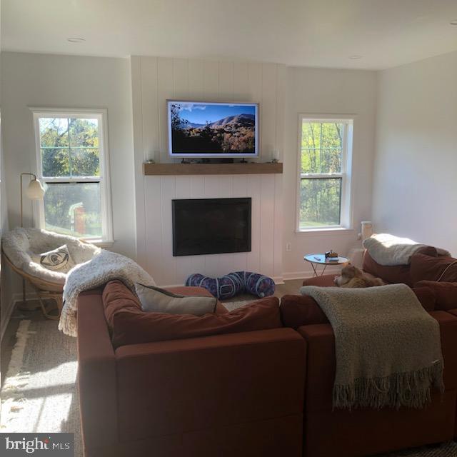 66 Brookview Drive Newport, PA 17074 - Photo 7 of 24 a living room with furniture a fireplace and a flat screen tv