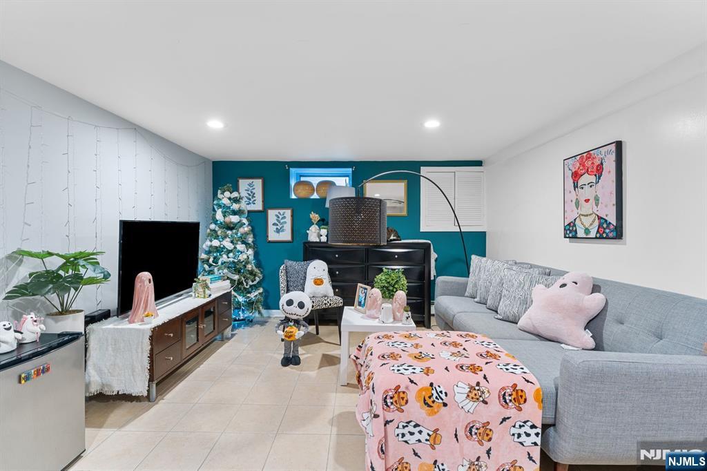 111 East 10th Street Linden, NJ 07036 - Photo 13 of 39 a living room with furniture and a flat screen tv