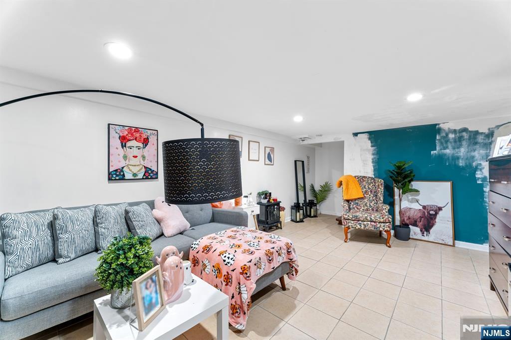 111 East 10th Street Linden, NJ 07036 - Photo 14 of 39 a living room with furniture and a flat screen tv