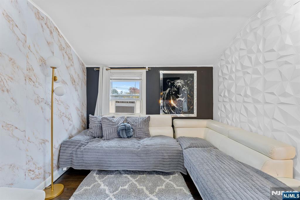 111 East 10th Street Linden, NJ 07036 - Photo 20 of 39 a bedroom with a large bed and a couch