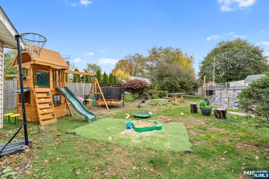 111 East 10th Street Linden, NJ 07036 - Photo 30 of 39 a childrens park with lots of swings and slides