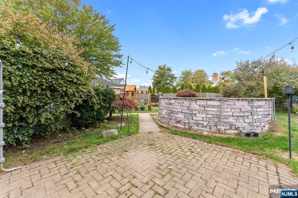 111 East 10th Street Linden, NJ 07036 - Photo 31 of 39 a view of a pathway with a wooden fence