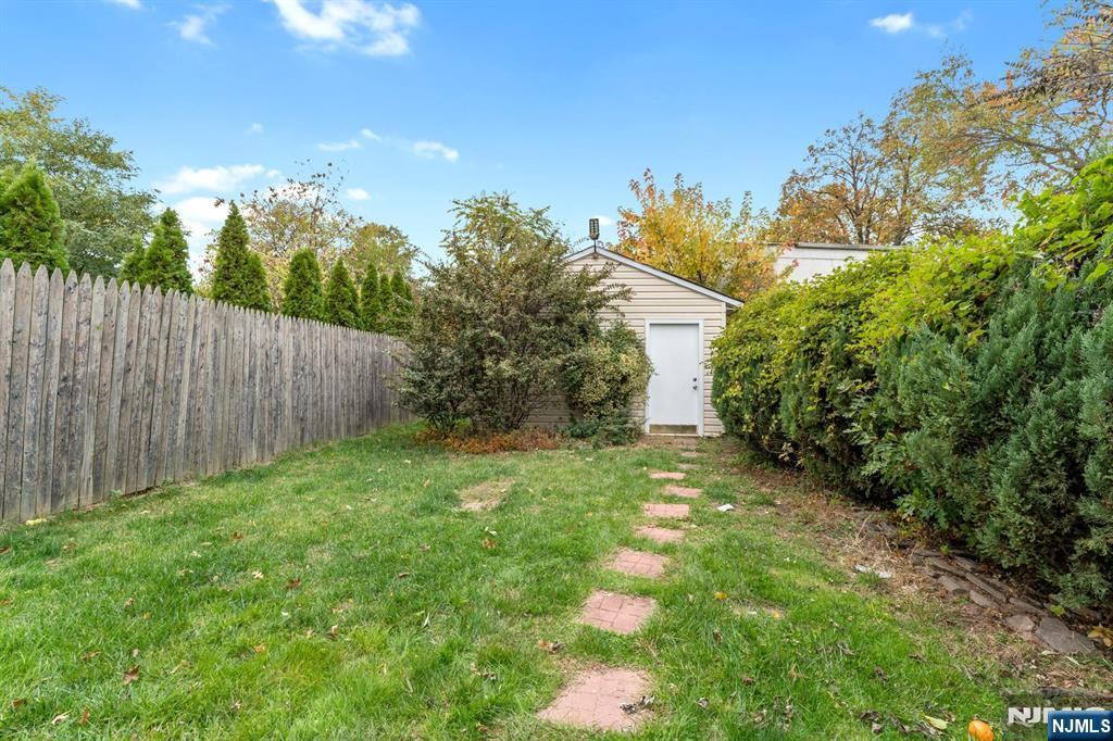111 East 10th Street Linden, NJ 07036 - Photo 32 of 39 a view of a yard with an tree and plants