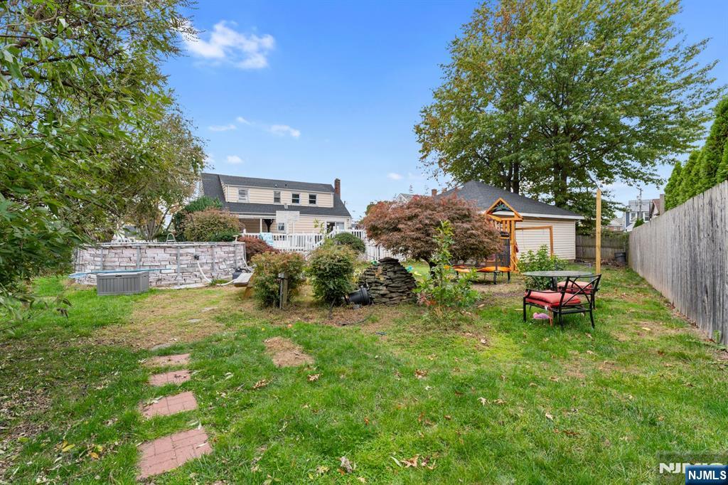 111 East 10th Street Linden, NJ 07036 - Photo 33 of 39 a front view of a house with a garden and deck
