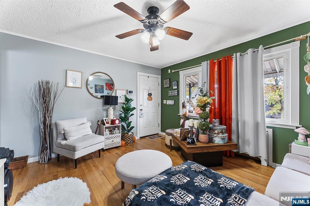 111 East 10th Street Linden, NJ 07036 - Photo 4 of 39 a living room with furniture and a large window