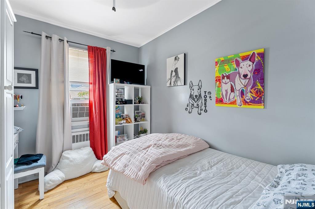 111 East 10th Street Linden, NJ 07036 - Photo 9 of 39 a bedroom with a bed and a large window