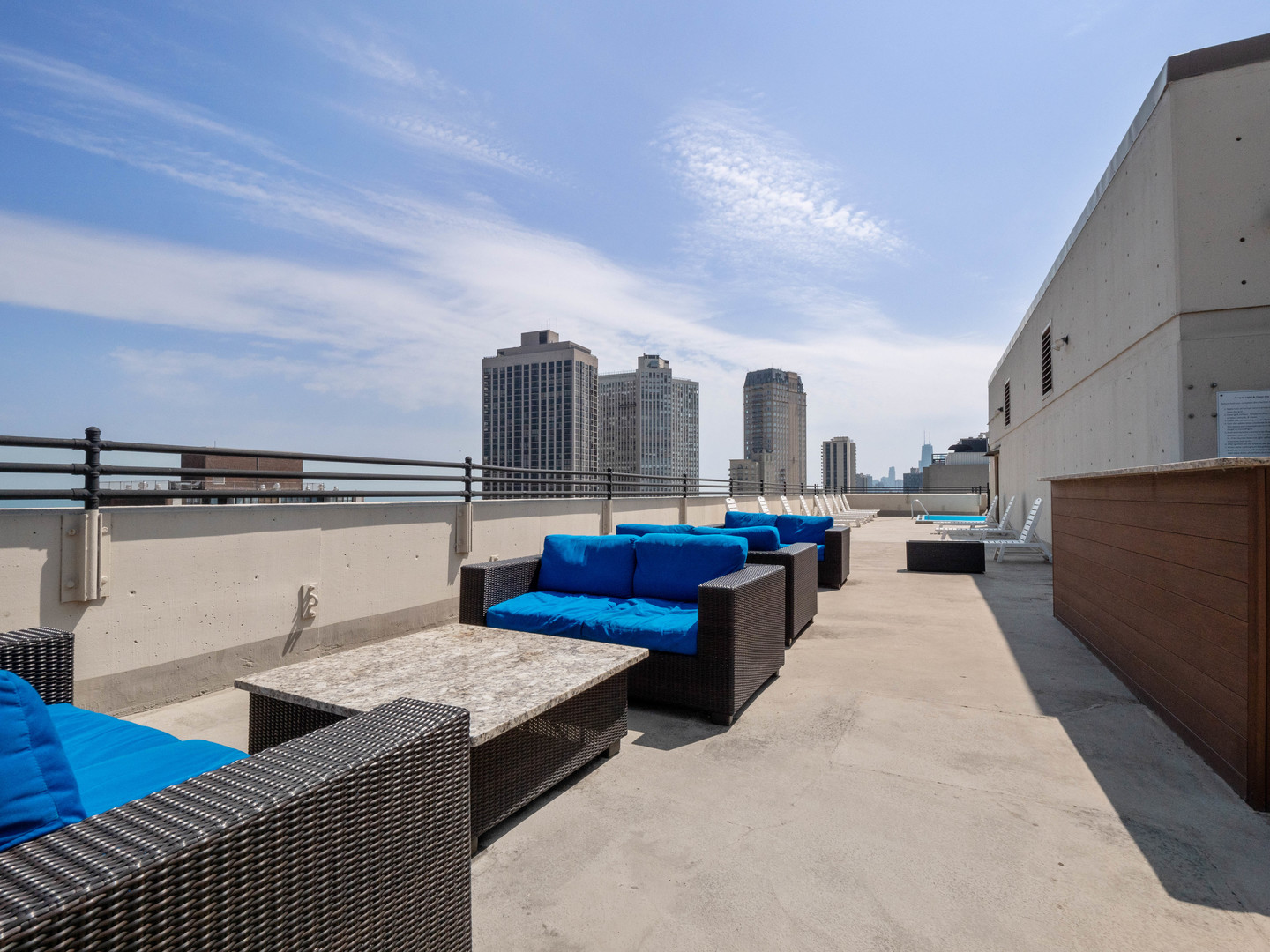2754 North Hampden Court, Unit 708 Chicago, IL 60614 - Photo 23 of 27 a living room with furniture a rug and white walls