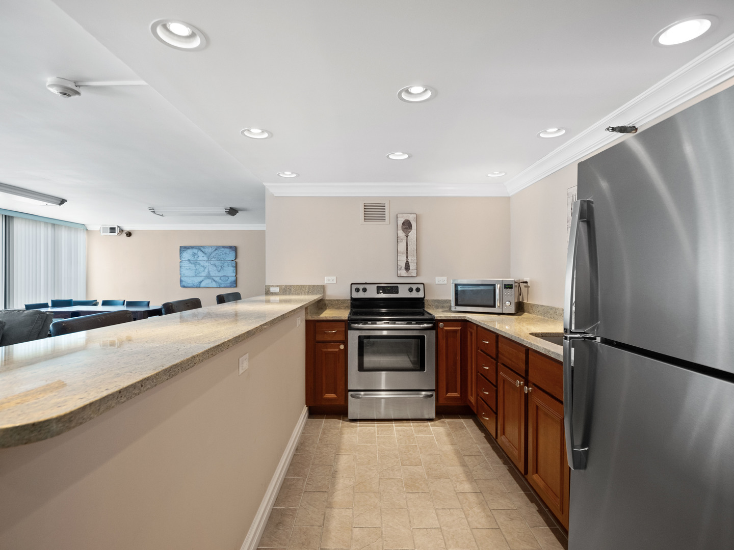 2754 North Hampden Court, Unit 708 Chicago, IL 60614 - Photo 26 of 27 a large kitchen with stainless steel appliances lots of counter top space