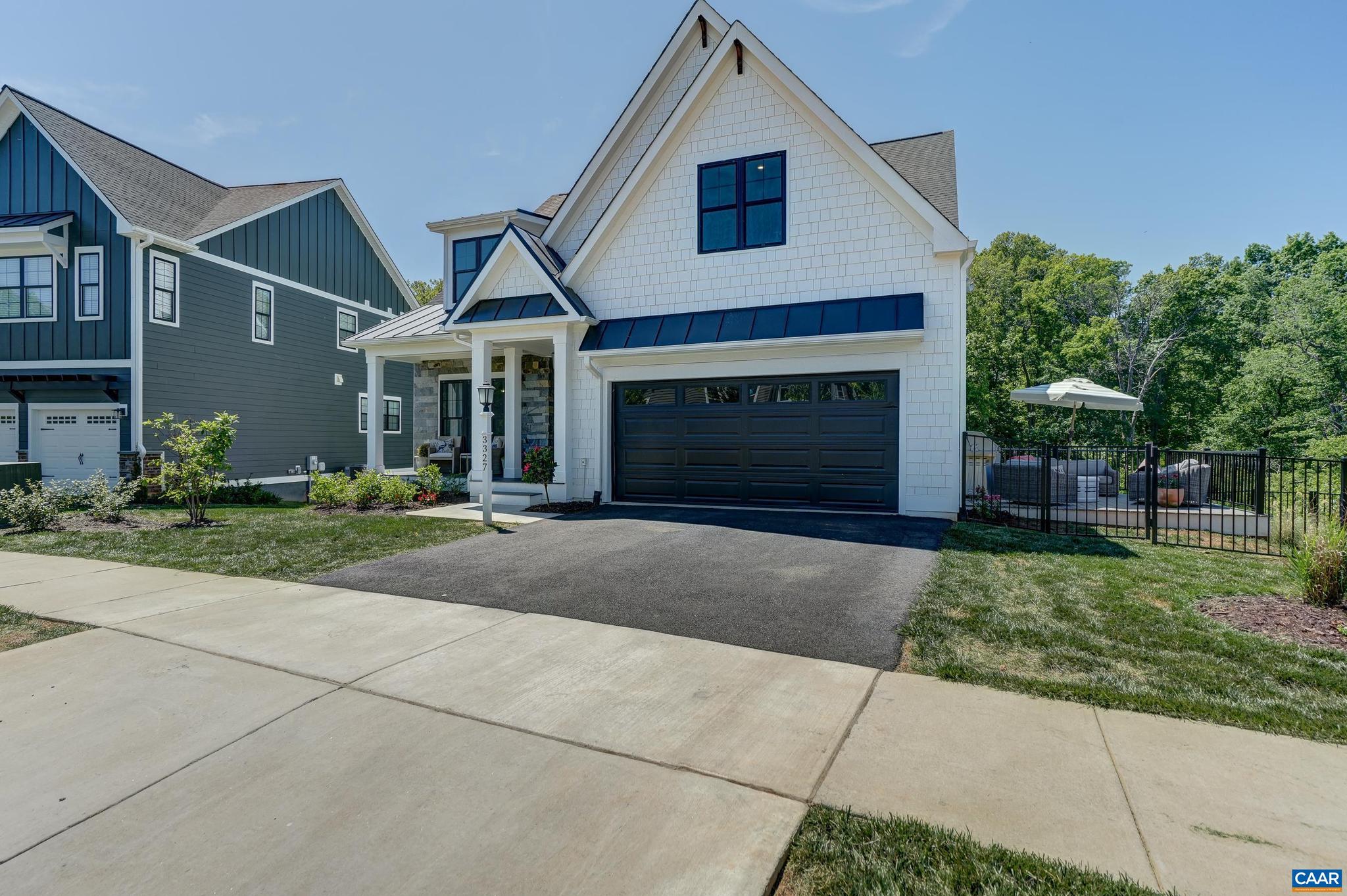 3327 Rowcross Street Crozet, VA 22932 - Photo 55 of 63 a front view of a house with a yard and garage