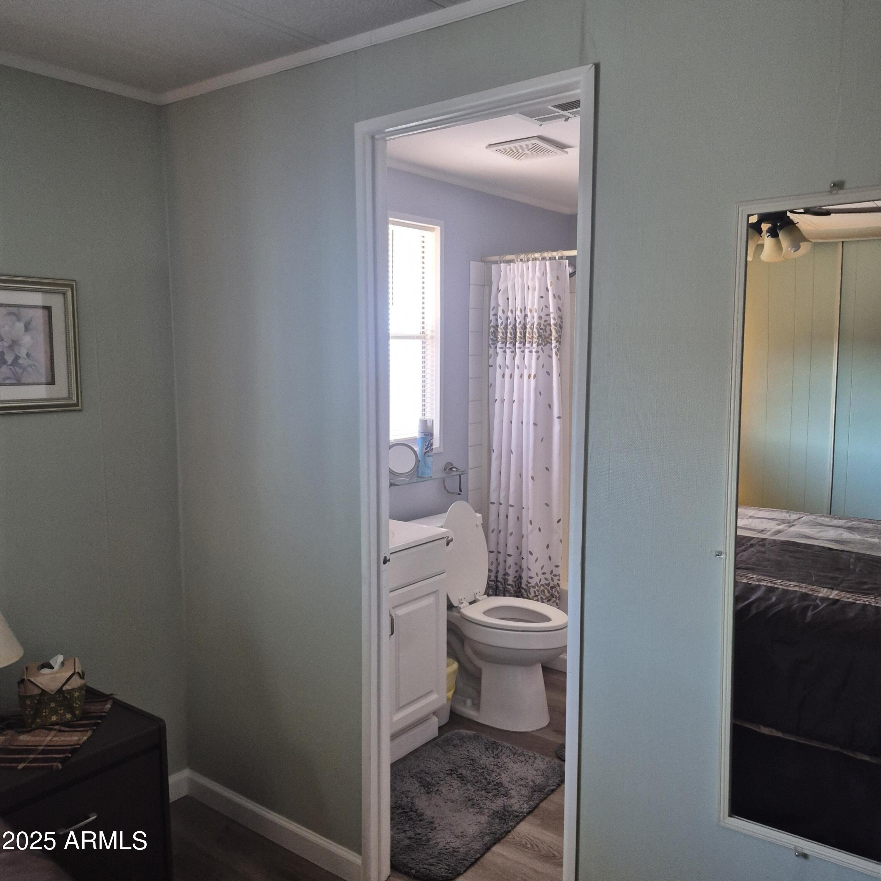 661 South Hawes Road, Unit 25 Mesa, AZ 85208 - Photo 17 of 50 a bathroom with a toilet a sink and shower