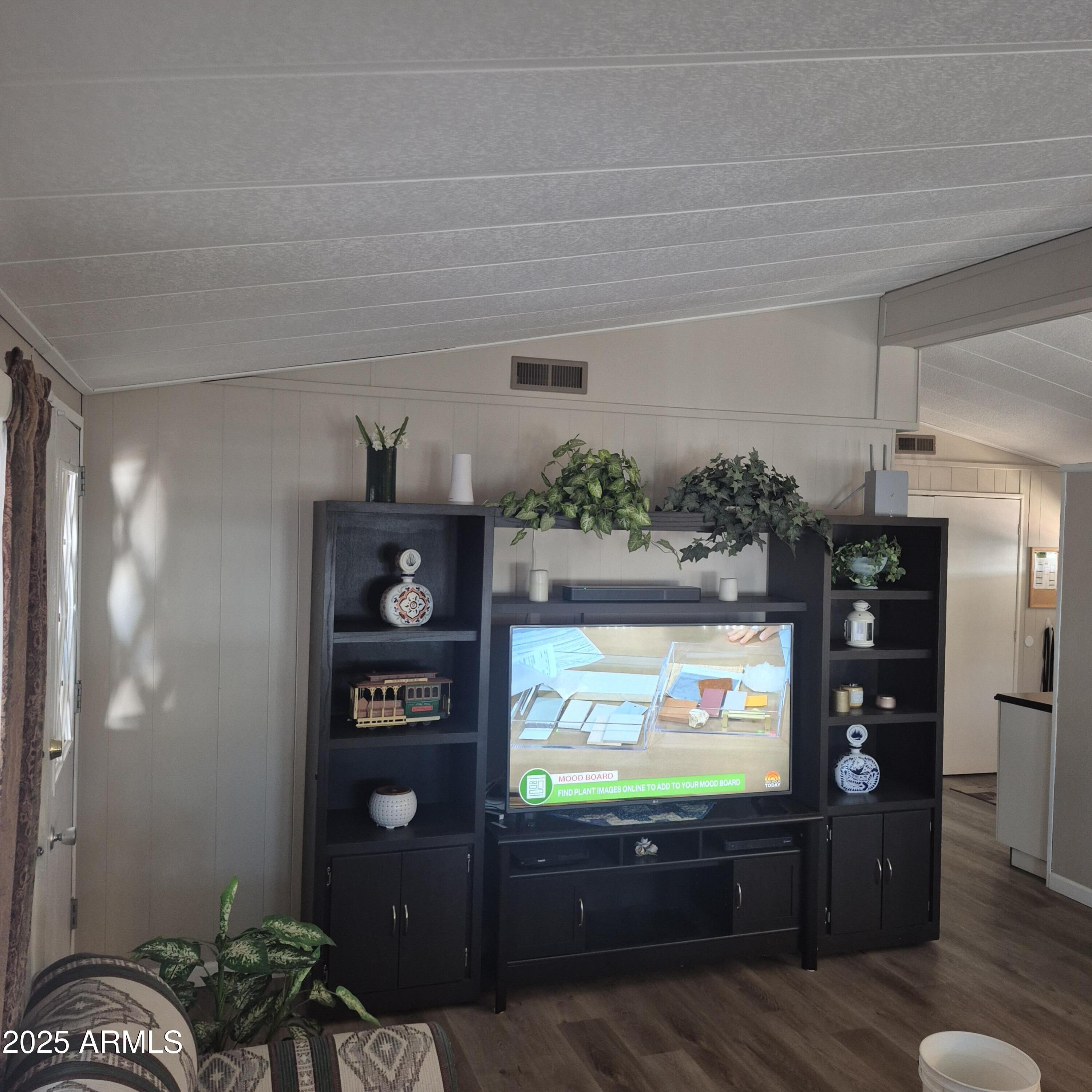 661 South Hawes Road, Unit 25 Mesa, AZ 85208 - Photo 24 of 50 a living room with furniture and a flat screen tv