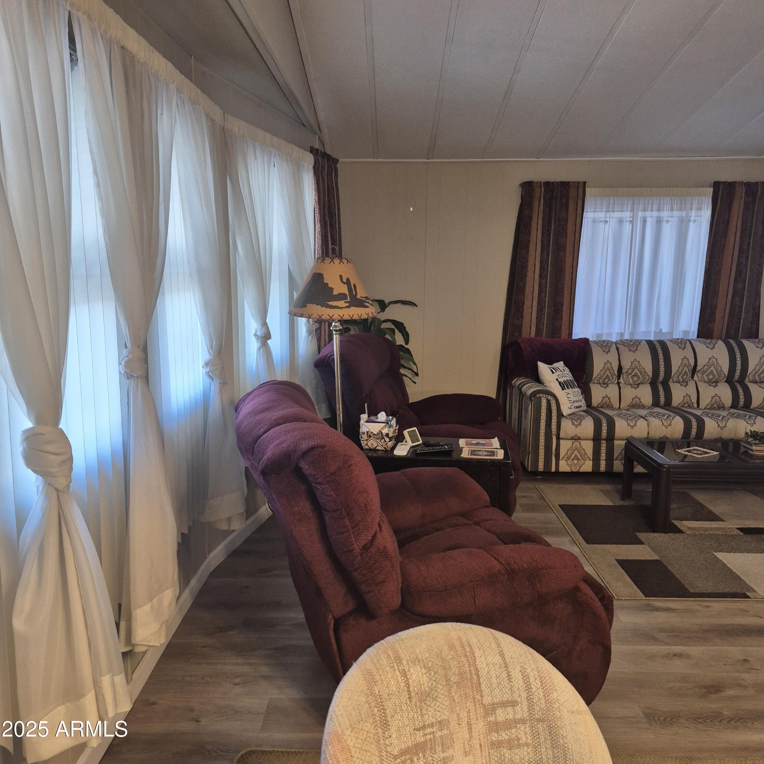 661 South Hawes Road, Unit 25 Mesa, AZ 85208 - Photo 26 of 50 a living room with furniture a couch and a window