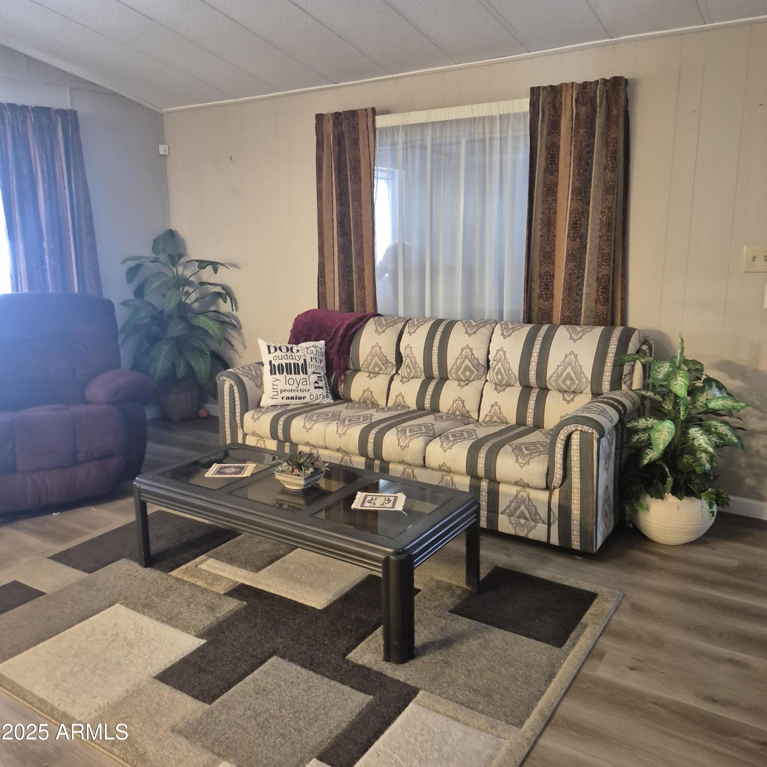 661 South Hawes Road, Unit 25 Mesa, AZ 85208 - Photo 27 of 50 a living room with furniture flowerpot and wooden floor