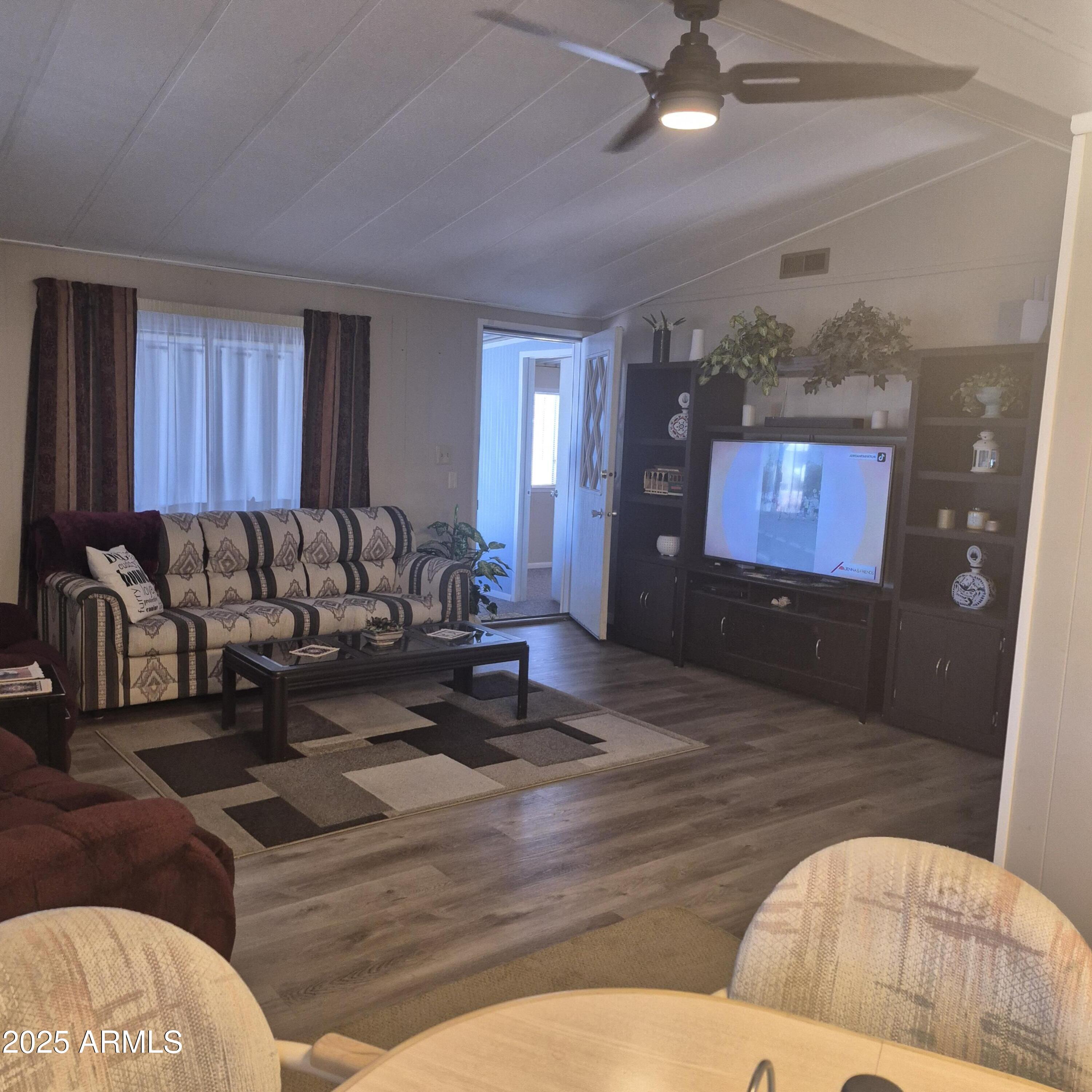 661 South Hawes Road, Unit 25 Mesa, AZ 85208 - Photo 28 of 50 a living room with furniture and a flat screen tv