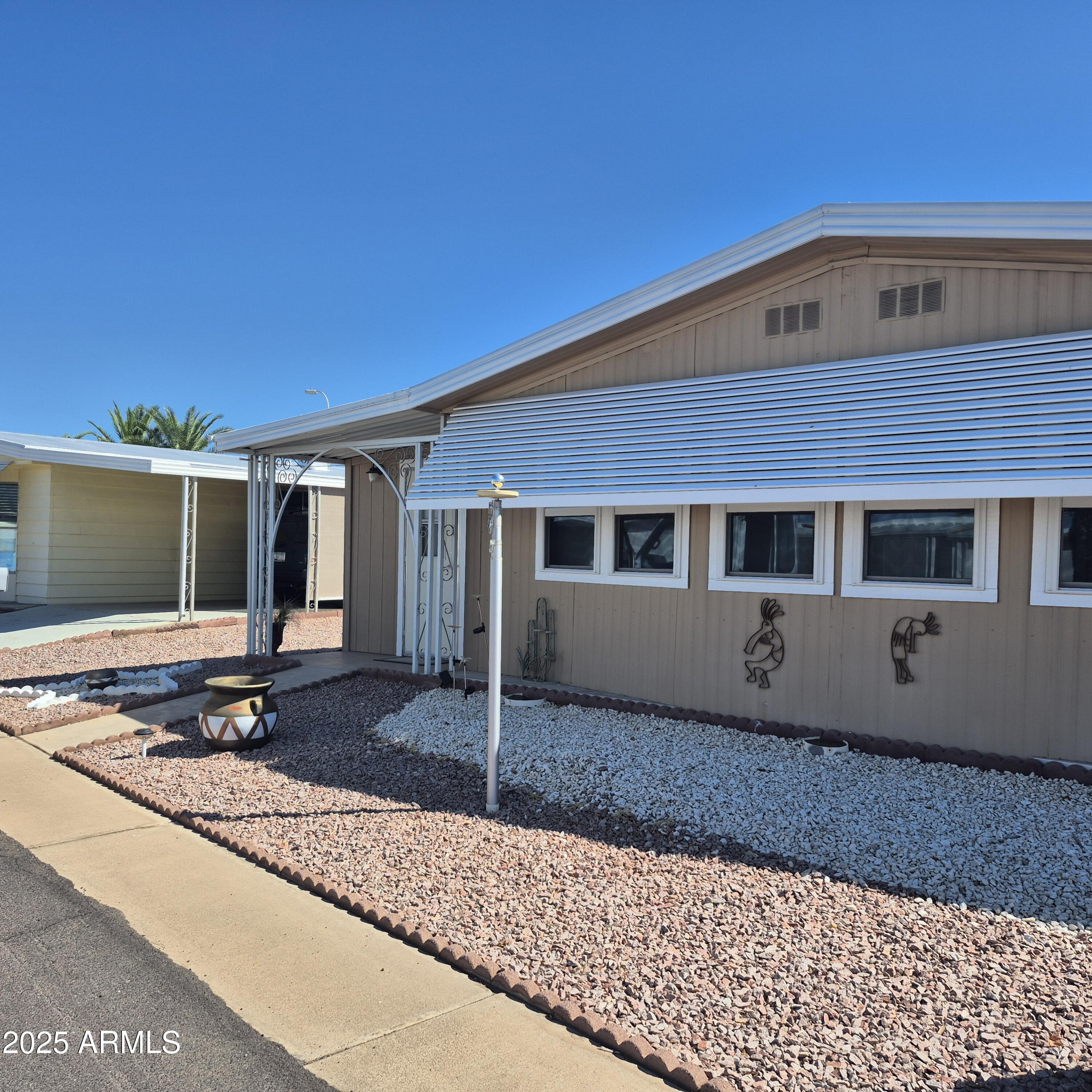 661 South Hawes Road, Unit 25 Mesa, AZ 85208 - Photo 3 of 50 a front view of a house with windows