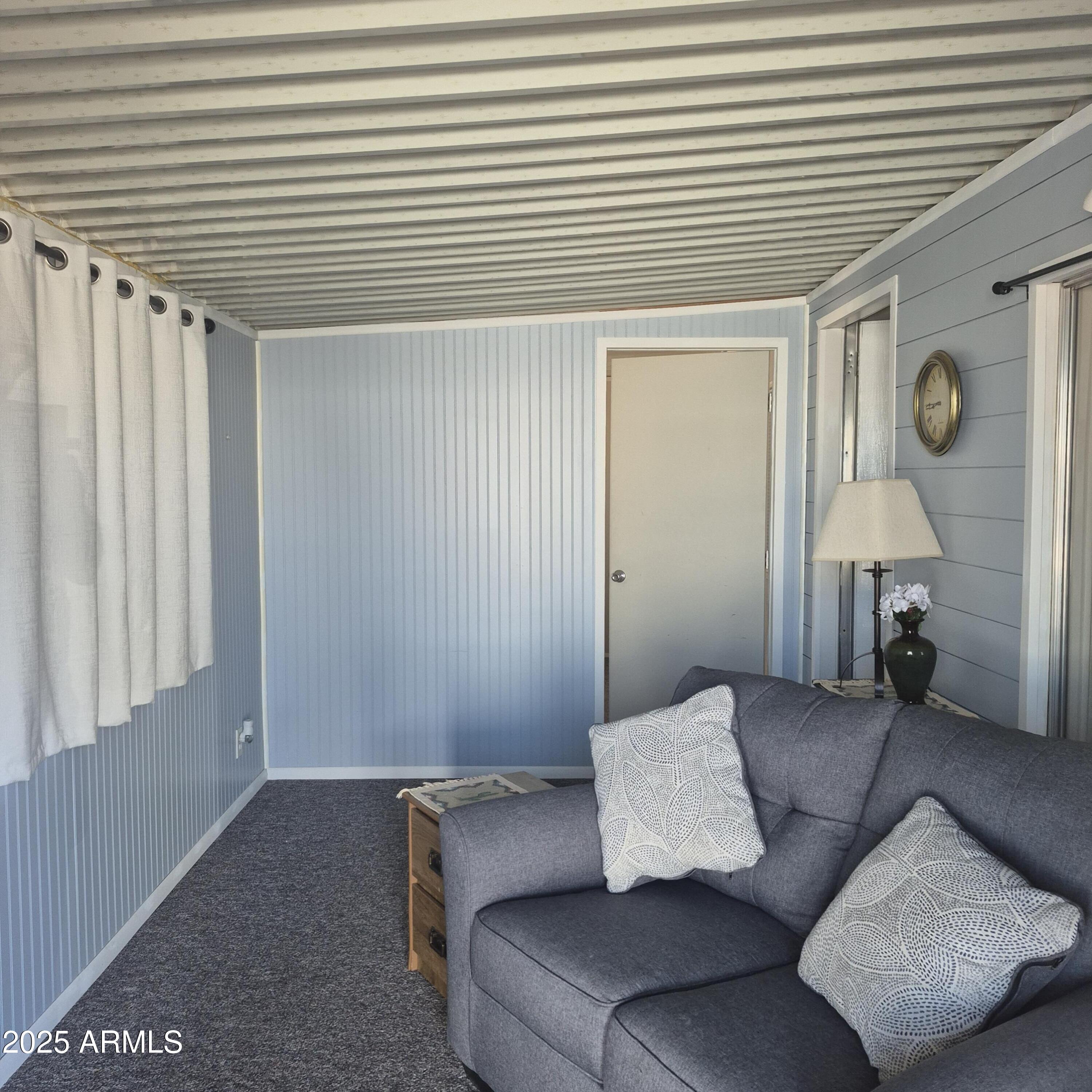661 South Hawes Road, Unit 25 Mesa, AZ 85208 - Photo 33 of 50 a living room with furniture and a window