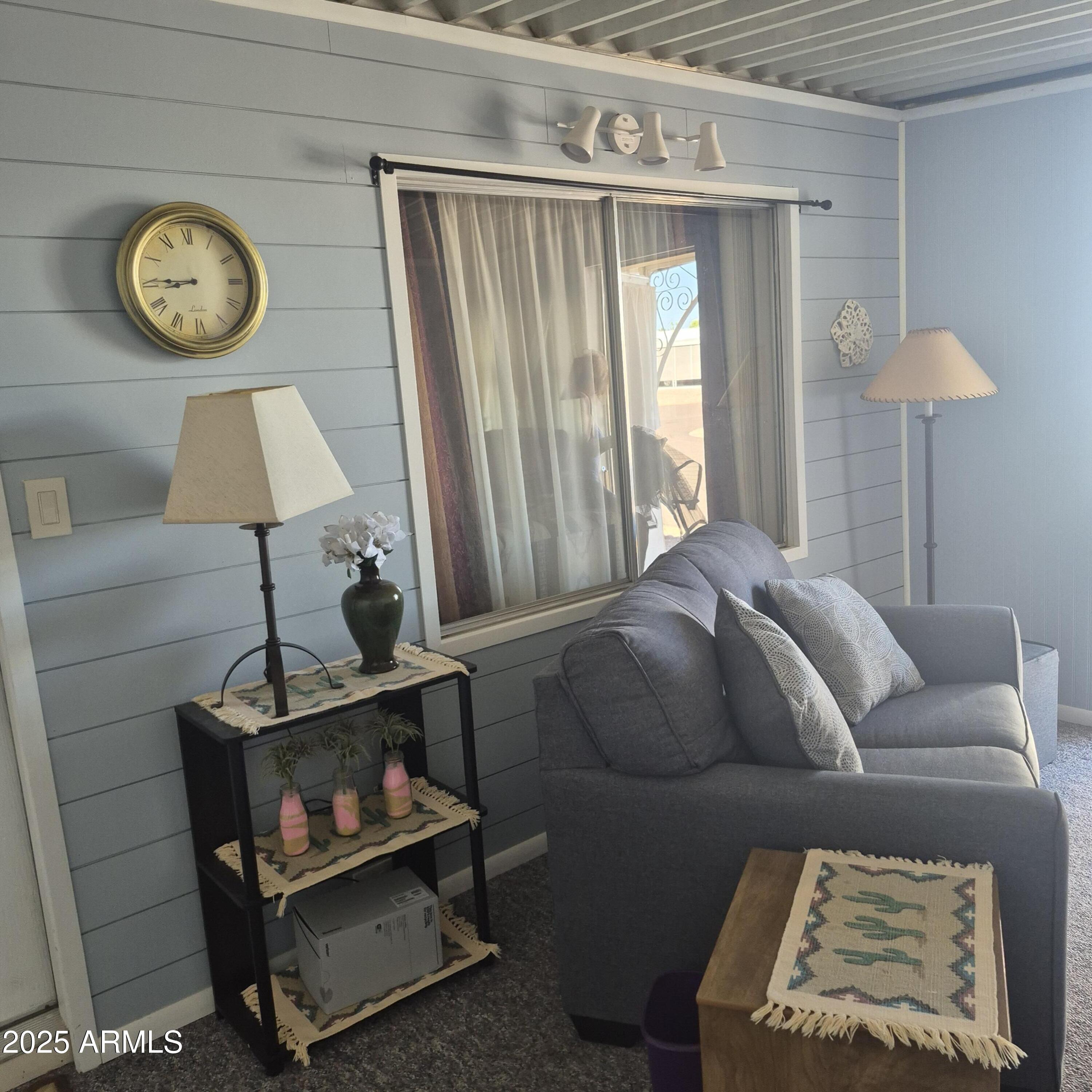 661 South Hawes Road, Unit 25 Mesa, AZ 85208 - Photo 34 of 50 a living room with furniture a window and a lamp