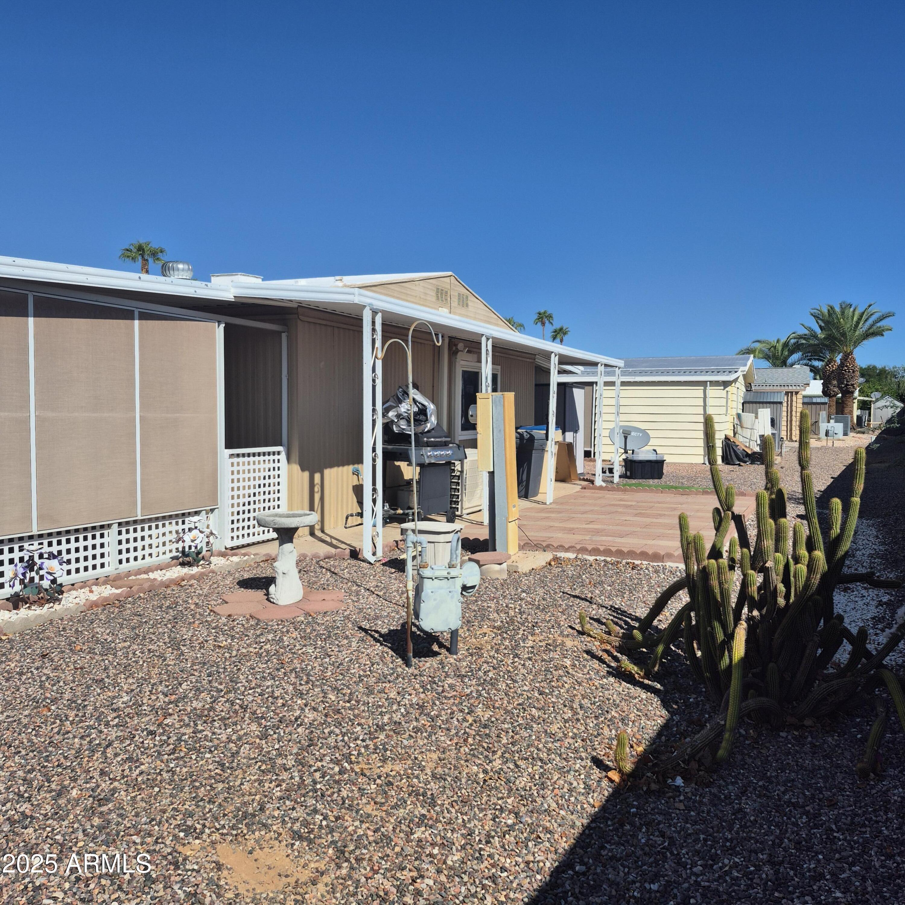 661 South Hawes Road, Unit 25 Mesa, AZ 85208 - Photo 39 of 50 a front view of a house with garden