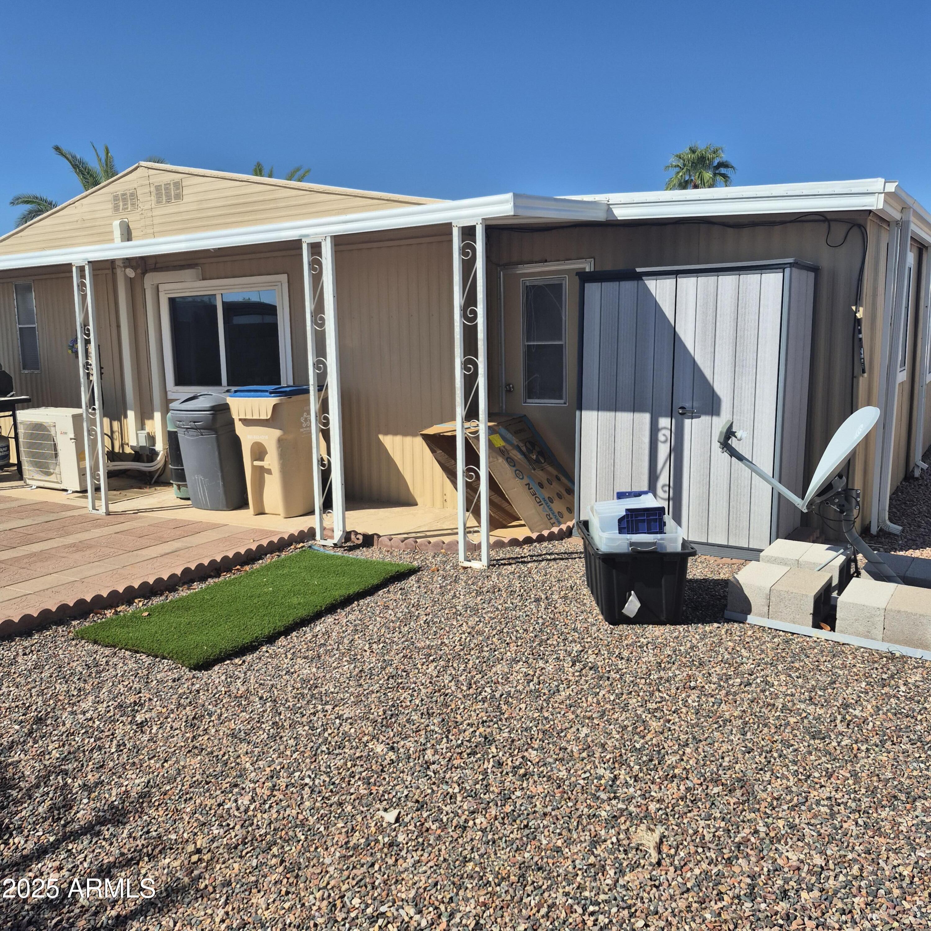 661 South Hawes Road, Unit 25 Mesa, AZ 85208 - Photo 44 of 50 a view of a house with backyard porch and sitting area