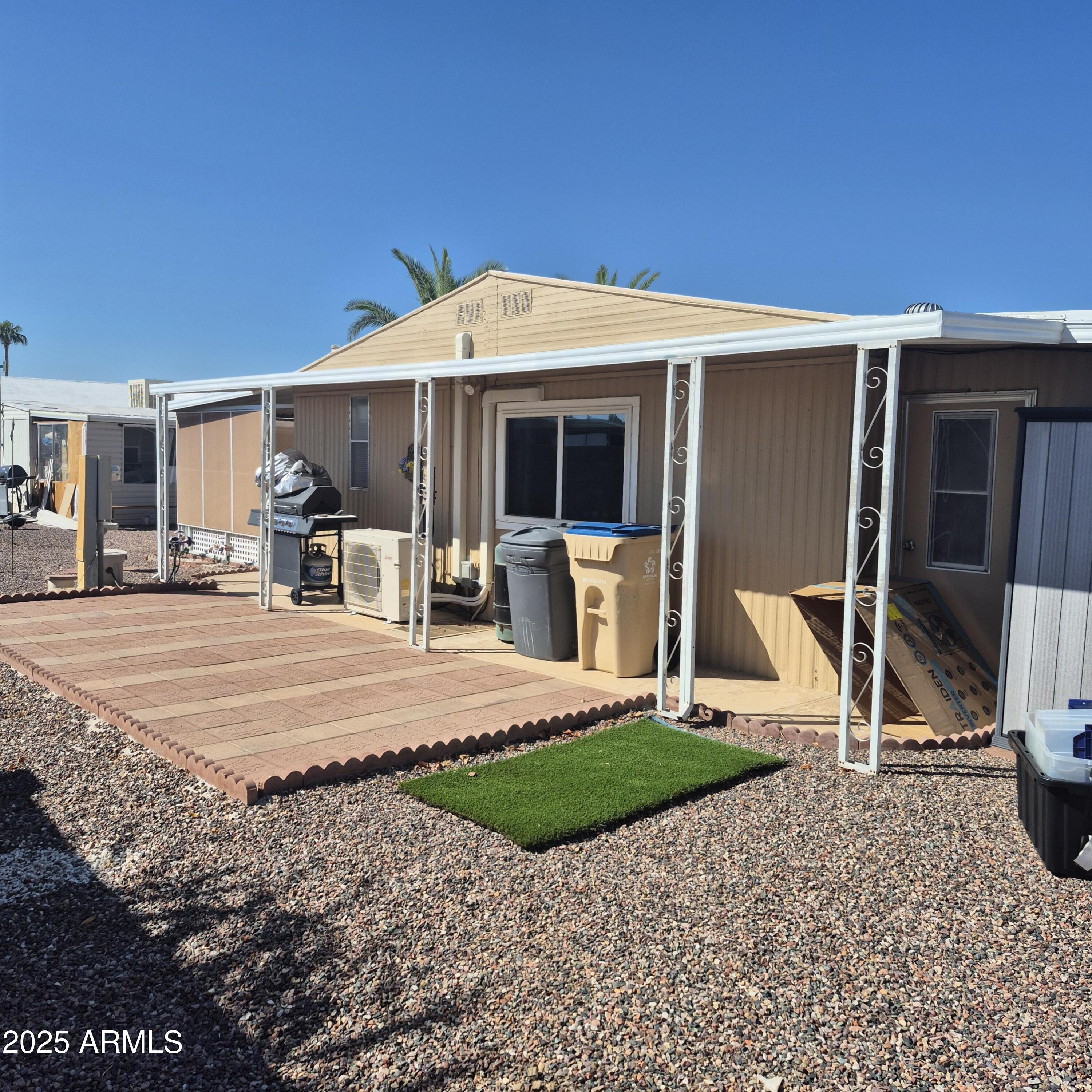661 South Hawes Road, Unit 25 Mesa, AZ 85208 - Photo 45 of 50 a view of a house with patio