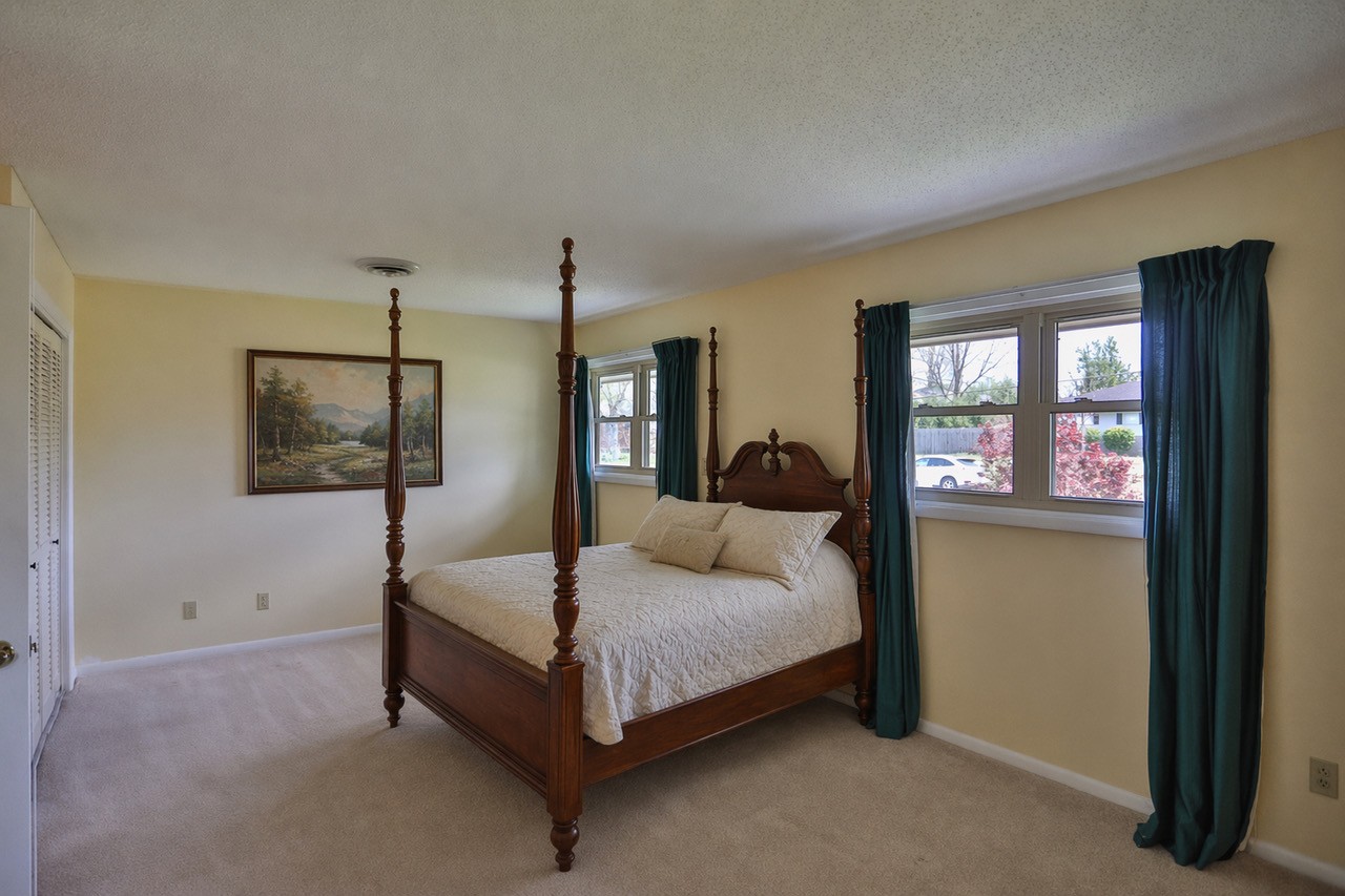 305 Myers Terrace Carthage, TN 37030 - Photo 19 of 75 a bedroom with a bed a mirror and a window