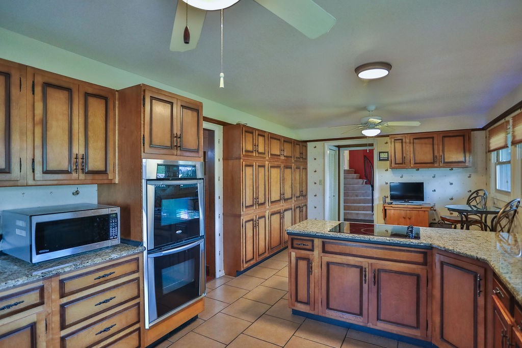 305 Myers Terrace Carthage, TN 37030 - Photo 3 of 75 a kitchen with stainless steel appliances granite countertop a refrigerator and a stove top oven