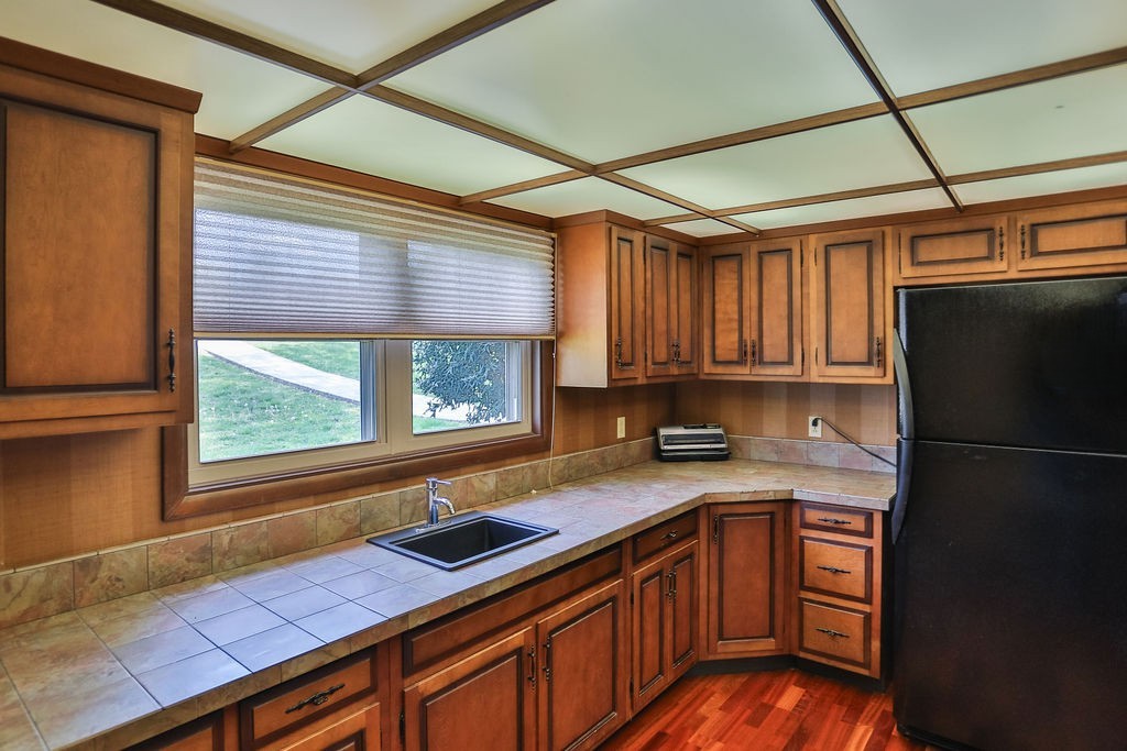 305 Myers Terrace Carthage, TN 37030 - Photo 33 of 75 a kitchen with a refrigerator and a sink