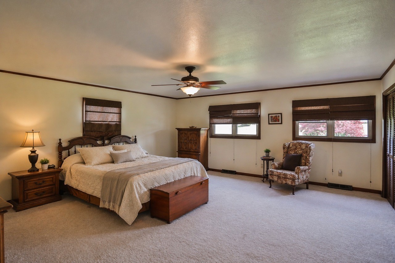 305 Myers Terrace Carthage, TN 37030 - Photo 39 of 75 a bedroom with a bed and a chandelier