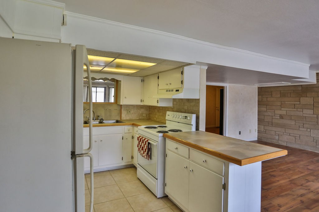 305 Myers Terrace Carthage, TN 37030 - Photo 59 of 75 a kitchen with a stove top oven sink and cabinets