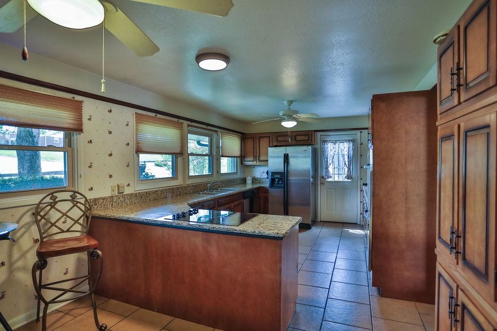 305 Myers Terrace Carthage, TN 37030 - Photo 6 of 75 a kitchen with stainless steel appliances granite countertop a sink a stove and a refrigerator