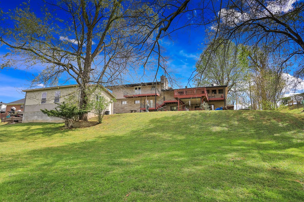 305 Myers Terrace Carthage, TN 37030 - Photo 65 of 75 a view of a house with a yard