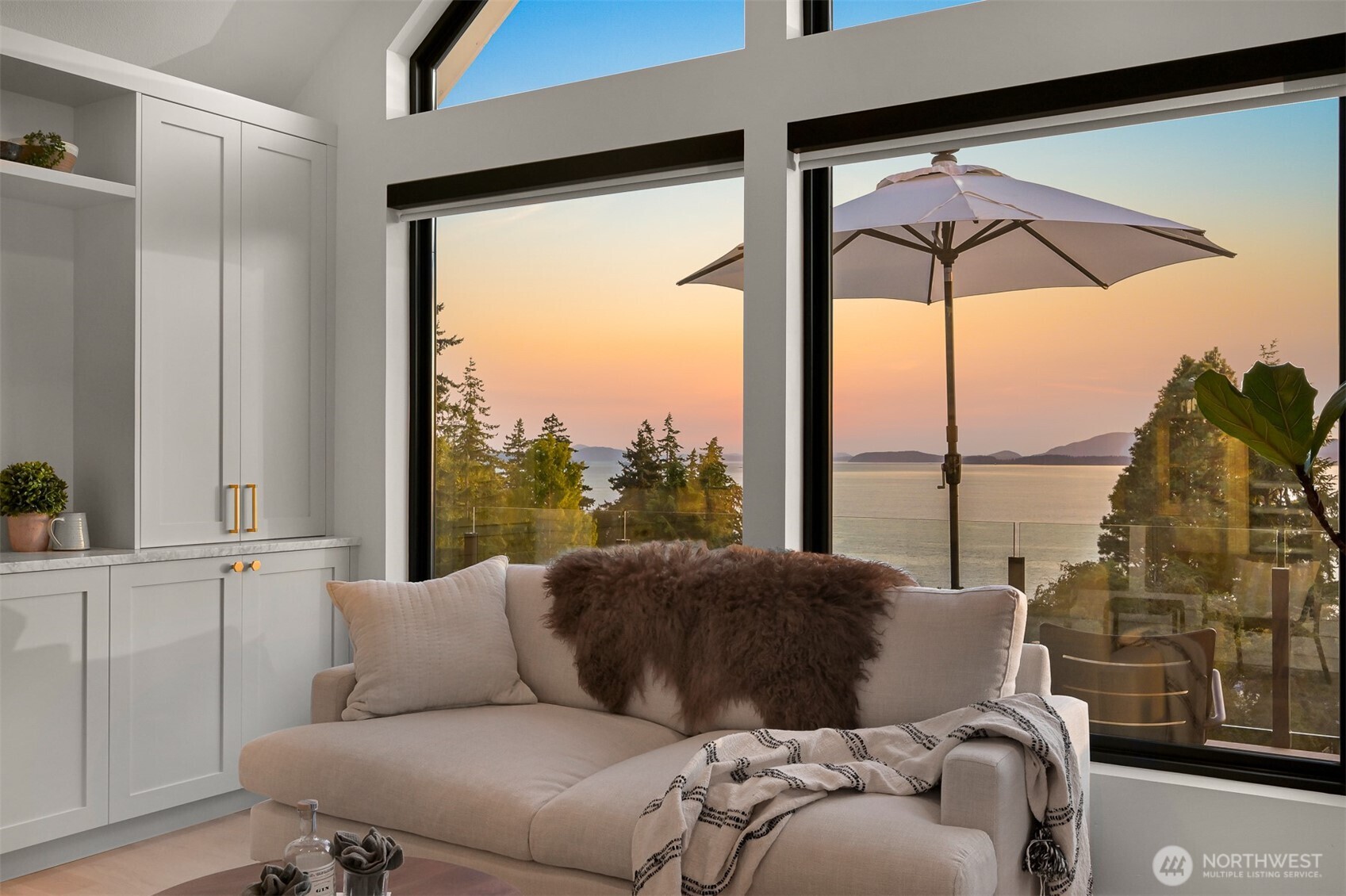 405 Bayside Road Bellingham, WA 98225 - Photo 19 of 40 a living room with furniture and a floor to ceiling window