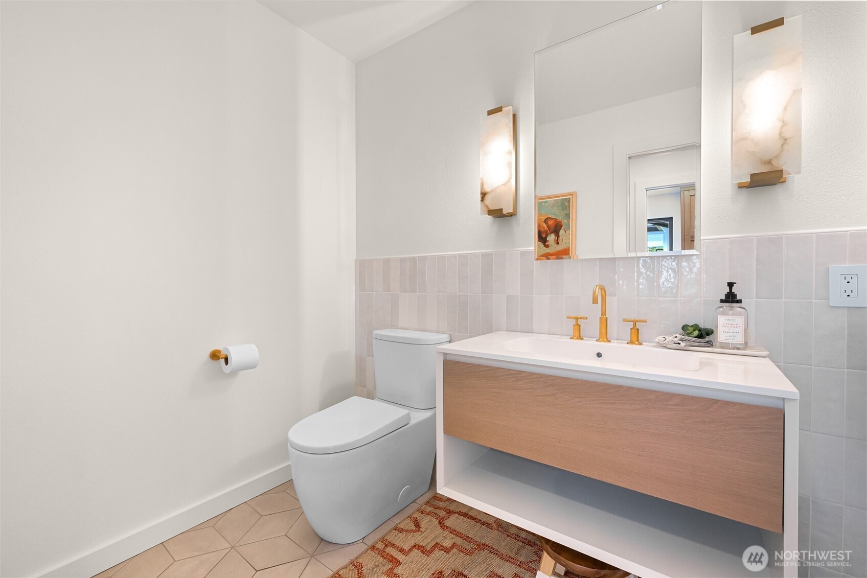 405 Bayside Road Bellingham, WA 98225 - Photo 27 of 40 a bathroom with a sink a toilet and a mirror