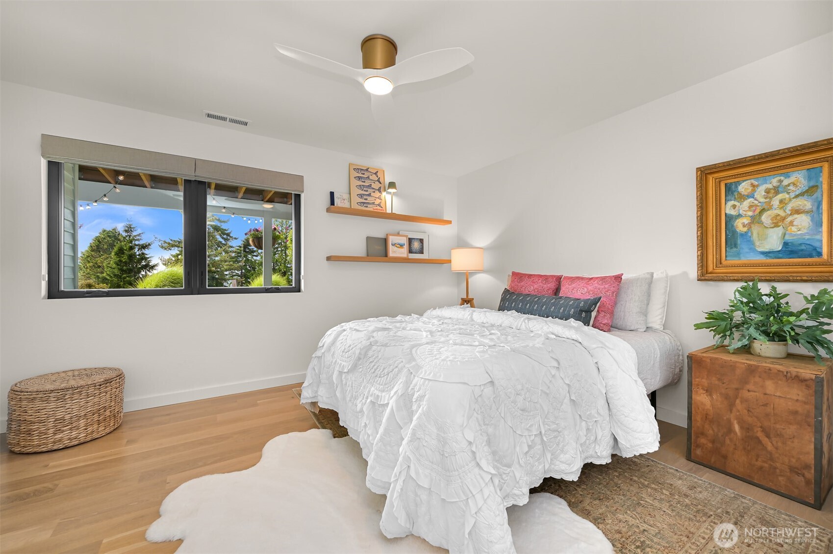 405 Bayside Road Bellingham, WA 98225 - Photo 32 of 40 a bedroom with a bed and a painting on the wall